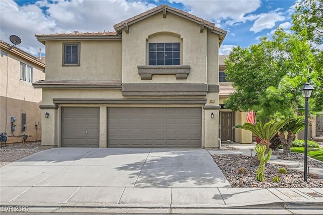 8217 Fritzen Ave, Las Vegas, NV 89131 - view of front facade with an attached garage, stucco siding, driveway, and a tiled roof