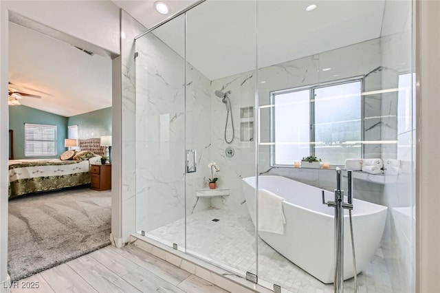 ensuite bathroom with a freestanding tub, lofted ceiling, ceiling fan, connected bathroom, and a marble finish shower