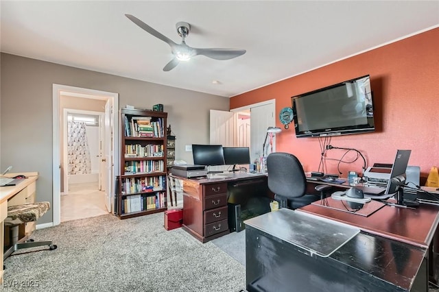 carpeted office with ceiling fan