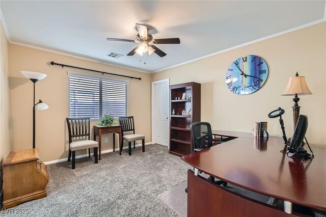 carpeted office featuring ceiling fan, visible vents, ornamental molding, and baseboards