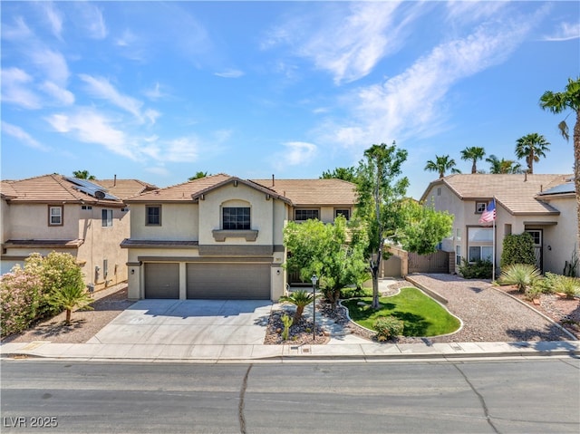 8217 Fritzen Ave, Las Vegas, NV 89131 - view of front of home with stucco siding, a garage, and concrete driveway