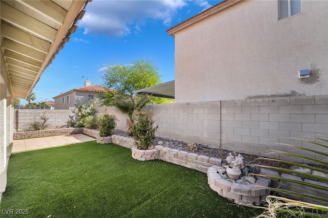 view of yard with a fenced backyard and a patio area