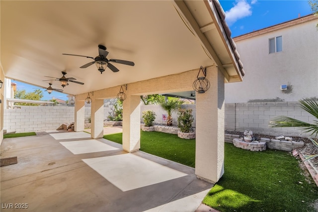 view of patio with a fenced backyard and a ceiling fan