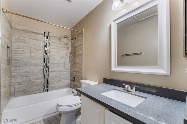 bathroom featuring vanity, toilet, and shower / tub combination
