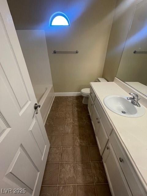 137 Coronation Ave, Las Vegas, NV 89123 - full bath featuring tile patterned flooring, vanity, toilet, baseboards, and a bathing tub