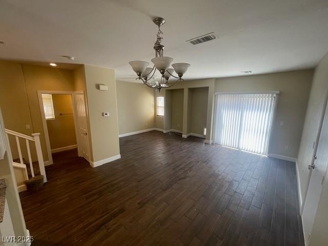 137 Coronation Ave, Las Vegas, NV 89123 - spare room featuring baseboards, a notable chandelier, and plenty of natural light