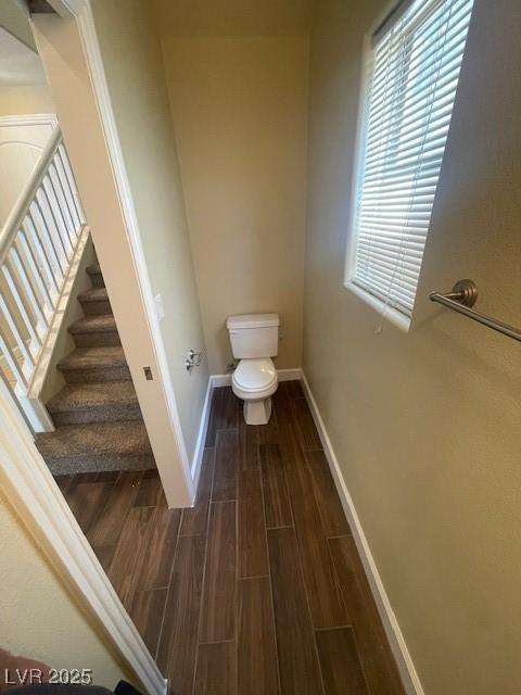 137 Coronation Ave, Las Vegas, NV 89123 - bathroom with toilet, baseboards, and wood finished floors