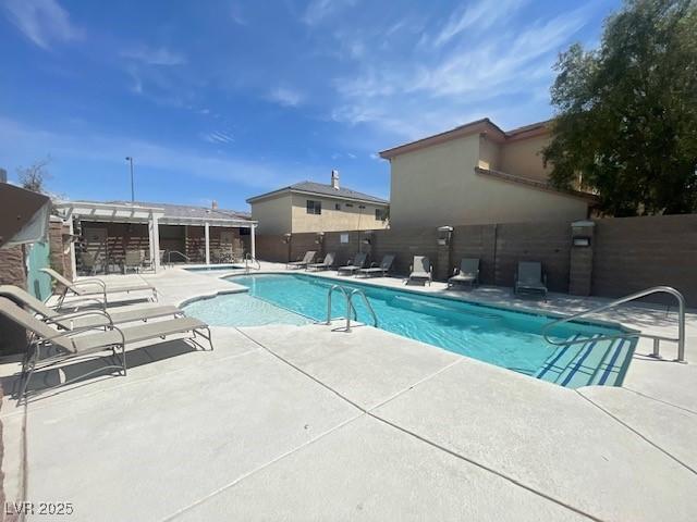 137 Coronation Ave, Las Vegas, NV 89123 - community pool with fence private yard and a patio area
