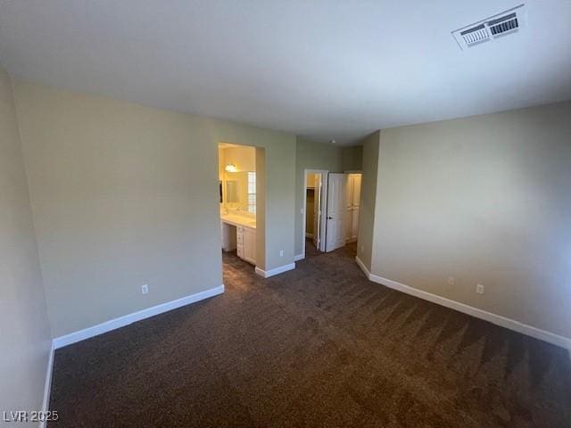 137 Coronation Ave, Las Vegas, NV 89123 - spare room featuring visible vents, baseboards, and dark colored carpet