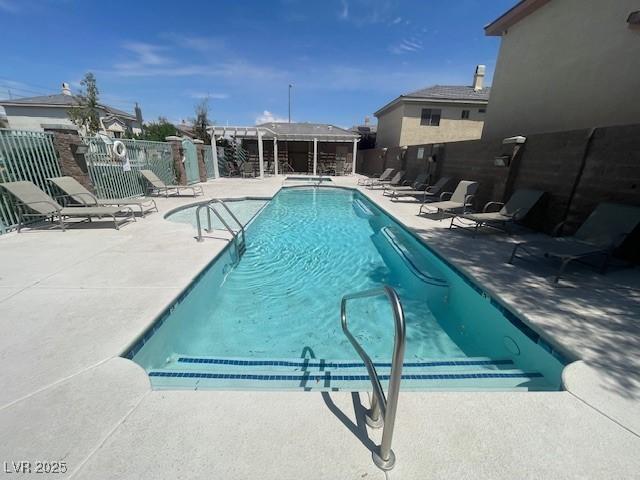 137 Coronation Ave, Las Vegas, NV 89123 - community pool featuring a patio and fence