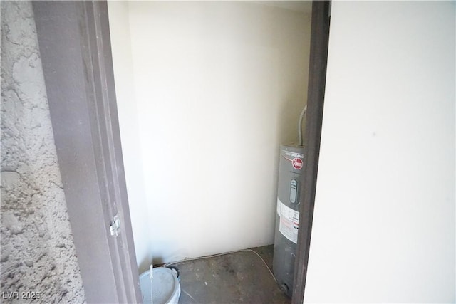 utility room featuring electric water heater