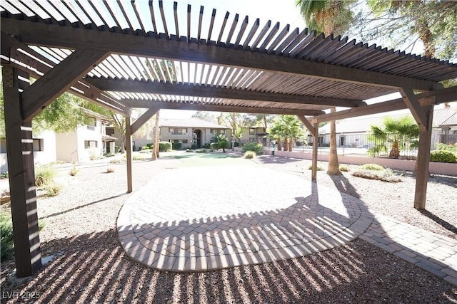view of patio / terrace featuring a pergola and a residential view