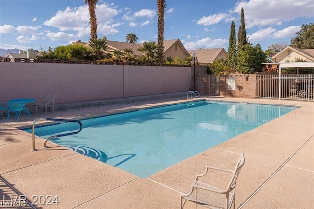 709 Jonathan Glen Way, Las Vegas, NV 89145 - community pool featuring a patio area