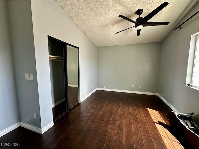 709 Jonathan Glen Way, Las Vegas, NV 89145 - unfurnished bedroom featuring a textured ceiling, wood finished floors, ceiling fan, and a closet