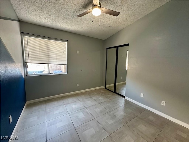 709 Jonathan Glen Way, Las Vegas, NV 89145 - unfurnished bedroom with a textured ceiling, a closet, and a ceiling fan