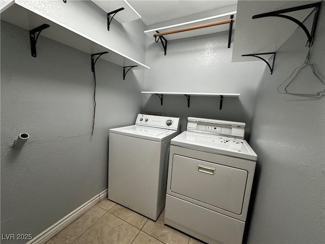 709 Jonathan Glen Way, Las Vegas, NV 89145 - laundry room with independent washer and dryer and light tile patterned floors