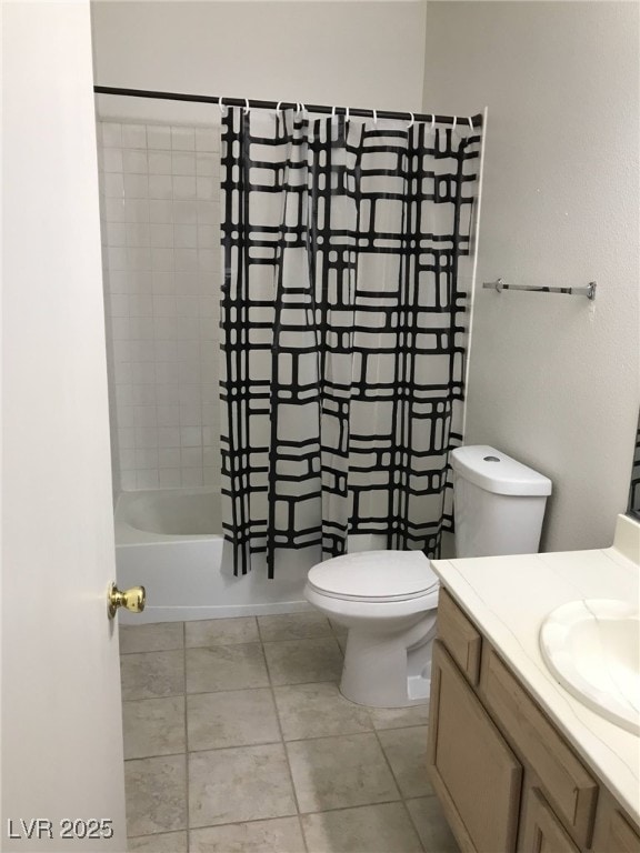 bathroom with vanity, tub / shower combination, tile patterned flooring, and toilet