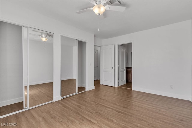7200 Pirates Cove Rd Unit 2025, Las Vegas, NV 89145 - unfurnished bedroom with light wood finished floors, baseboards, ensuite bathroom, and a ceiling fan