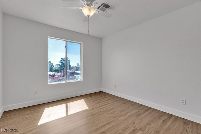 7200 Pirates Cove Rd Unit 2025, Las Vegas, NV 89145 - unfurnished room with wood finished floors, baseboards, and a ceiling fan