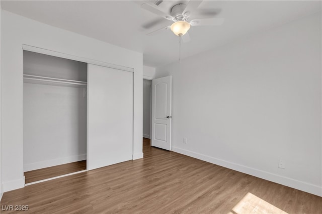 7200 Pirates Cove Rd Unit 2025, Las Vegas, NV 89145 - unfurnished bedroom with wood finished floors, baseboards, a closet, and ceiling fan