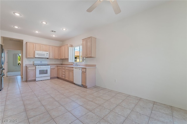 1781 Cypress Lake Ct, Henderson, NV 89012 - kitchen with white appliances, light brown cabinetry, a healthy amount of sunlight, and light countertops