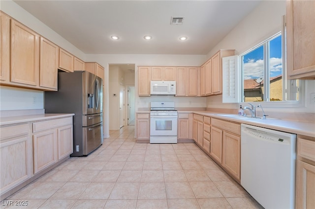 1781 Cypress Lake Ct, Henderson, NV 89012 - kitchen with white appliances, visible vents, a sink, and light brown cabinets