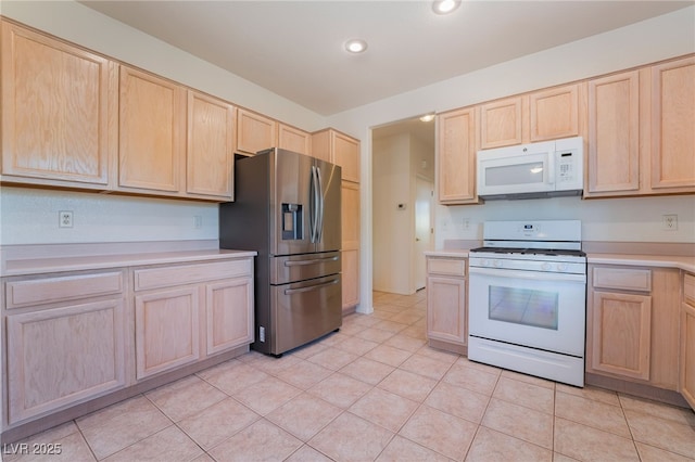 1781 Cypress Lake Ct, Henderson, NV 89012 - kitchen featuring white appliances, light countertops, light tile patterned floors, and light brown cabinets