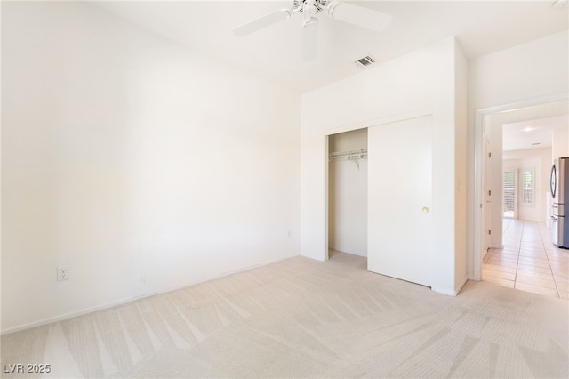 1781 Cypress Lake Ct, Henderson, NV 89012 - unfurnished bedroom featuring ceiling fan, light colored carpet, visible vents, freestanding refrigerator, and a closet