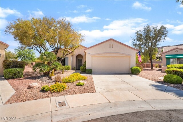 1781 Cypress Lake Ct, Henderson, NV 89012 - mediterranean / spanish-style home with a garage, stucco siding, and concrete driveway