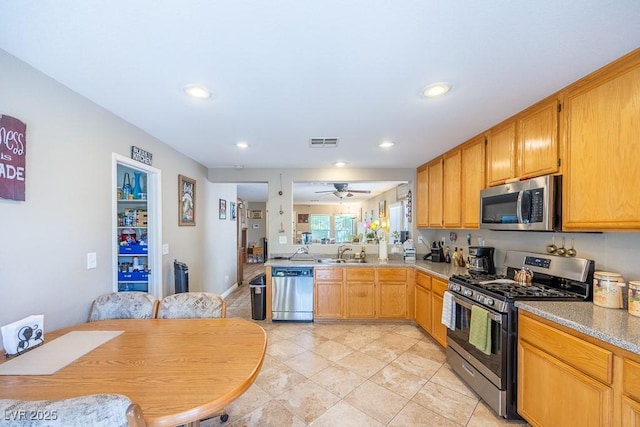 kitchen featuring ceiling fan, visible vents, appliances with stainless steel finishes, a sink, and recessed lighting