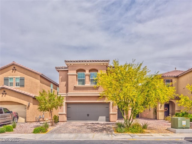 156 Fulgora St, Henderson, NV 89074 - view of front of property featuring an attached garage, decorative driveway, stucco siding, and a tile roof