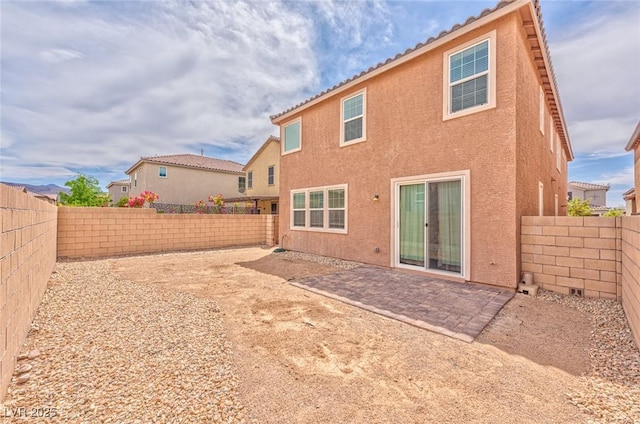 156 Fulgora St, Henderson, NV 89074 - rear view of property featuring a fenced backyard, a patio area, and stucco siding
