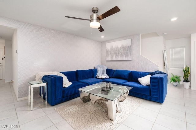 living area featuring ceiling fan, light tile patterned floors, wallpapered walls, an accent wall, and recessed lighting