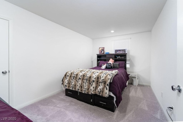 carpeted bedroom featuring baseboards