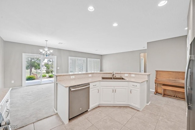 2525 Willow Wren Dr, North Las Vegas, NV 89084 - kitchen featuring appliances with stainless steel finishes, a sink, a chandelier, white cabinets, and light tile patterned floors