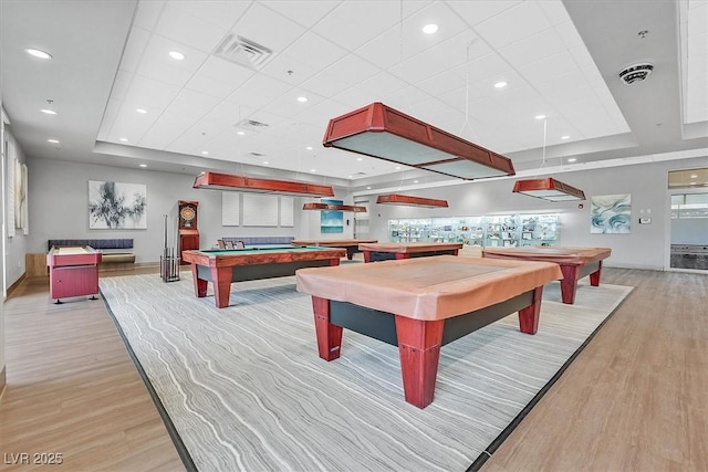 2525 Willow Wren Dr, North Las Vegas, NV 89084 - playroom with billiards table, a raised ceiling, light wood-style floors, and a drop ceiling
