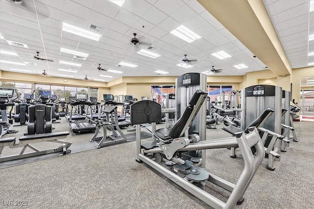 2525 Willow Wren Dr, North Las Vegas, NV 89084 - exercise room featuring a paneled ceiling, plenty of natural light, carpet, and ceiling fan