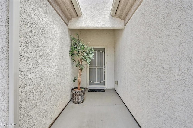 2525 Willow Wren Dr, North Las Vegas, NV 89084 - doorway to property featuring stucco siding