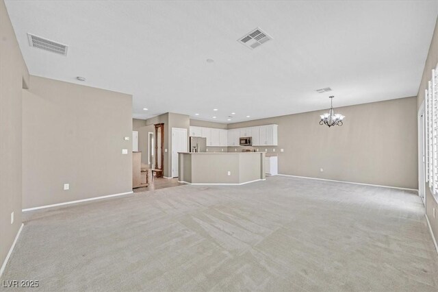 2525 Willow Wren Dr, North Las Vegas, NV 89084 - unfurnished living room with a chandelier, baseboards, light carpet, and recessed lighting
