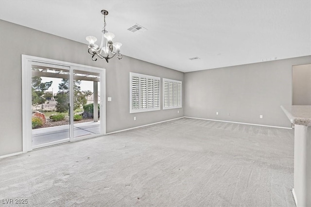 2525 Willow Wren Dr, North Las Vegas, NV 89084 - unfurnished living room featuring a chandelier, baseboards, and light colored carpet