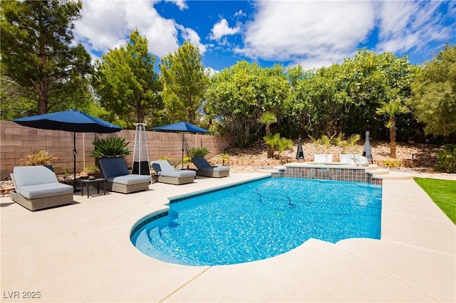 view of swimming pool with a patio, fence, and a fenced in pool