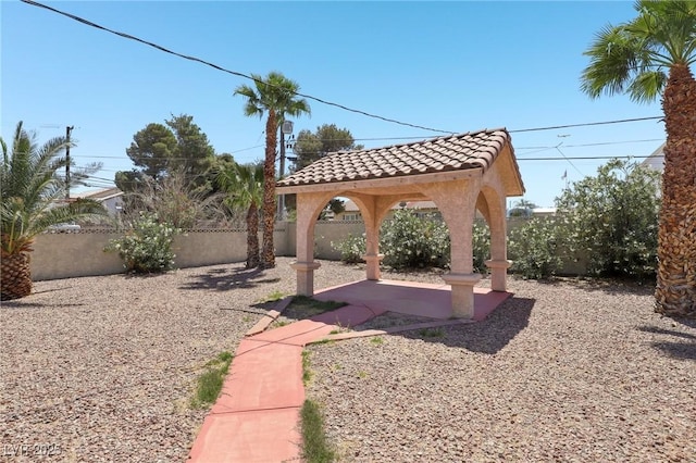 view of yard featuring a gazebo, a patio area, and fence