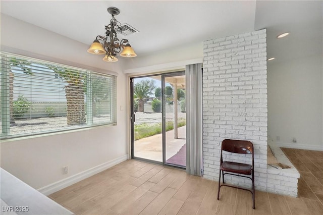 doorway featuring light wood-style floors, a chandelier, recessed lighting, baseboards, and visible vents