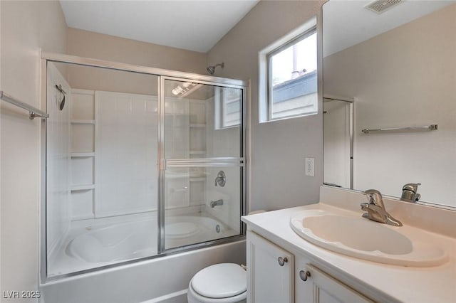 full bathroom with visible vents, toilet, shower / bath combination with glass door, and vanity