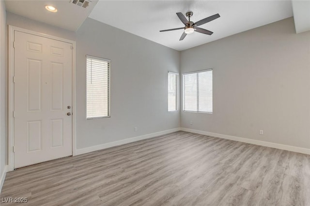spare room with a ceiling fan, visible vents, light wood-type flooring, baseboards, and recessed lighting