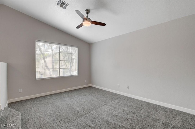 carpeted empty room featuring baseboards, a ceiling fan, lofted ceiling, and visible vents