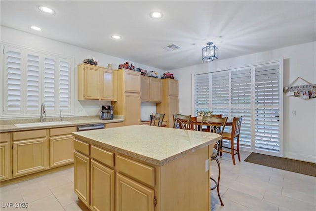 7013 Bisoni St, Las Vegas, NV 89149 - kitchen featuring a sink, light brown cabinets, a kitchen island, recessed lighting, and light tile patterned floors