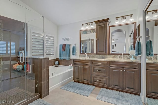 7013 Bisoni St, Las Vegas, NV 89149 - bathroom featuring a garden tub, tile patterned flooring, a stall shower, and double vanity