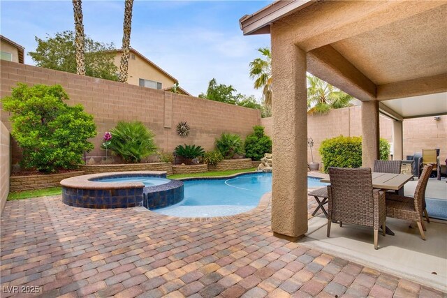 7013 Bisoni St, Las Vegas, NV 89149 - view of swimming pool with a fenced backyard, a patio, a pool with connected hot tub, and outdoor dining space