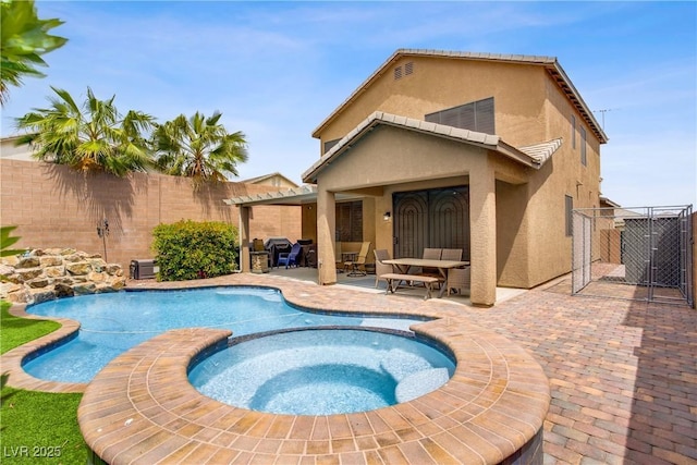 7013 Bisoni St, Las Vegas, NV 89149 - view of pool featuring a patio, a fenced backyard, a gate, and a pool with connected hot tub